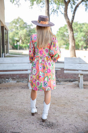 Colorful Print Dress On Girl In White Boots With Felt Hat